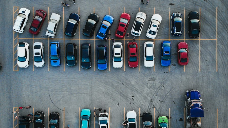 Overhead view of a car park showing vehicles of many different colors